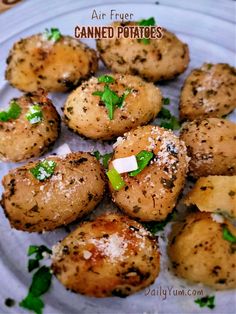 baked potatoes with parmesan and herbs on a plate