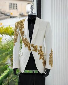 Make a statement in this Bespoke exquisitely crafted white tuxedo jacket. This jacket is perfect for any special occasion, from a wedding to a black-tie gala. It features a classic, tailored fit with a sleek, modern silhouette. The jacket is crafted from high-quality, luxurious fabric and is adorned with intricate golden beading and gems details. The jacket is fully lined and has a single button closure. The jacket comes with a matching pocket square and is a must-have for any man's wardrobe. Cu White And Gold Suit Men, Knights Tale, Floral Tuxedo, Tuxedo Suit For Men, White Tuxedo Jacket, Blazer Design, Gold Suit, Prom Outfit, Suit For Men