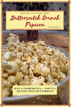 a bowl filled with popcorn sitting on top of a wooden table