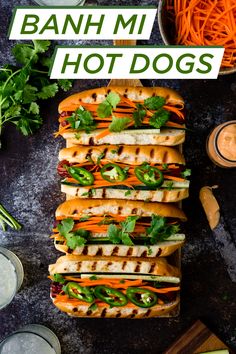 Overhead view of hot dogs topped with pickled carrots, cilantro, and sriracha mayo. Banh Mi Hot Dog, Bahn Mi Hot Dog, Hotdogs Recipes, American Hot Dog, Sausage Sizzle, Boyfriend Food, Vietnamese Banh Mi, Banh Mi Sandwich, Gourmet Hot Dogs