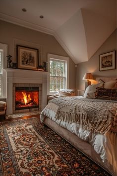 a bedroom with a fire place in the fireplace and rugs on the floor next to it