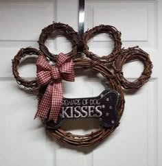 There is always a dog lover in the family. This adorable dog paw reminds people of the love for your pet. This wreath measures approximately 21 wide by 17 tall. #DogPaw Paw Wreath, Dog Wreaths, Dog Kisses, Bone Dog, Dog Wreath, Grapevine Wreaths, Grooming Salon, Burlap Bow, Burlap Bows