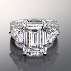 Embrace meticulous handwork with a mesmerizing blend of individuality that mirrors your unique love story. Exuding glamour, this ring features a shimmering split pave band that leads to a jaw-dropping emerald-cut diamond center stone. Right in the middle of each splitting shoulder is a pear diamond that also serves as a side stone. The rail that secures the central gem is also lined with petite round diamonds for a sparkle that never ends. Pave Rings, Dig Jewelry, Princess Life, Emerald Cut Diamond Engagement Ring, Expensive Jewelry Luxury, Sf 49ers, Mercedes Maybach, Emerald Diamond Ring, Diamond Jewel