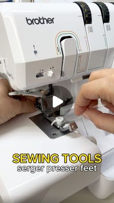 a person using a sewing machine to sew