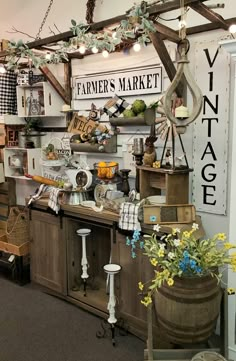 an old fashioned store with lots of items on the shelves and decorations hanging from the ceiling