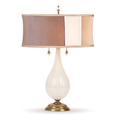 a table lamp with two shades of brown and white on the lampshade,