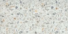 an image of a white and grey surface with small rocks on it's sides