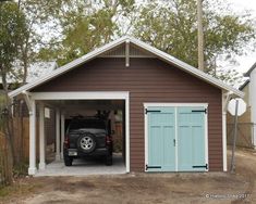 a car is parked in the garage with its door open