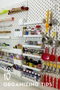 the top ten organizing tips for kitchen cabinets and drawers are organized with pegs to hold utensils