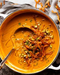 a bowl filled with soup and garnished with nuts