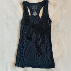 95% Rayon, 5% Spandex. Nwot. So Cute! Base Is Light Black And Sequins Are Dark Black. Y2k Style Stretch Tank Vest, Stretch Tank Top Vest For Night Out, Fitted Racerback Tank Top For Night Out, Y2k Style Tank Top For Night Out, Y2k Style Stretch Cotton Vest, Stretch Racerback Tank Top For Night Out, Y2k Fitted Vest For Party, Stretch Tank Top For Night Out, Cotton Camisole Tank Top For Party