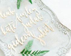 the cake is decorated with leaves and words