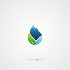 the logo for a company with mountains and leaves in the center, on a white background