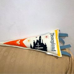 an orange and white toothbrush shaped like a castle