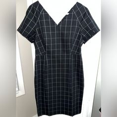 New Without Tags Banana Republic Black And White Window Pane Plaid Print Ponte Stretch Shift Dress, Size 12p Petite. Lightweight And Stretchy Cotton/Rayon/Spandex/Polyester Blend. Double V-Neck And With Short, Cap Sleeves. Rear Zipper Closure And Very Comfortable. Great To Layer With A Jacket Or Cardigan, It Simply By Itself! Easy To Dress Up Or Down And Coming From My Smoke And Pet Free Home. The Bust Measures 17.5 Inches Across And The Waist Measures 15 Inches Across. The Length Measures 38.5 White Window, White Windows, Window Pane, Banana Republic Dress, Plaid Print, Shift Dress, Cap Sleeves, Banana Republic, Dress Up