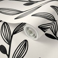 a white and black wallpaper with leaves on it