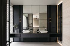 a large bathroom with two sinks and mirrors