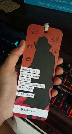 a person is holding up a tag with the name of their favorite character