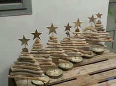 a wooden table topped with lots of logs and stars