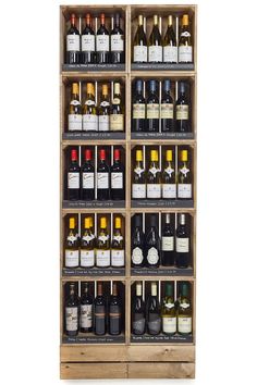 a wooden shelf filled with lots of bottles of wine on top of eachother