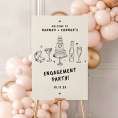 a welcome sign with champagne glasses and cake on it next to balloons in the background