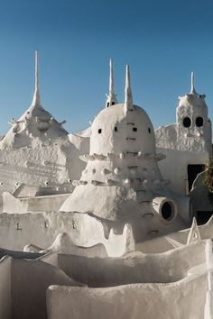 an intricately designed white building in the desert