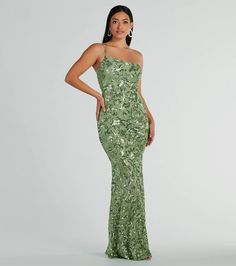 Get a luxe look for your next fancy night out in the stunning Meredith sequin formal dress. She features a sleeveless bodice, an asymmetrical one-shoulder neckline with dual adjustable spaghetti straps, and a back zipper and hook and eye closure. She has a floor-length, form-hugging mermaid silhouette to highlight your curves. The dress is composed of a sheer mesh fabric with an all-over gorgeous sequin embroidered floral design and includes a stretchy knit lining. Complete your outfit with rhin Sage Green Dress Prom, Sparkling Sequin Fabric For Prom Evening, Sparkling Sequin Fabric For Evening Prom, Holiday Sequined Evening Dress For Homecoming, Glamorous Sequin Fabric For Prom And Gala, Glamorous Sequin Fabric For Homecoming And Prom, Glamorous Sequin Fabric For Gala And Prom, Elegant Sparkling Sequin Dress For Homecoming, Elegant Sequin Dress For Homecoming Gala