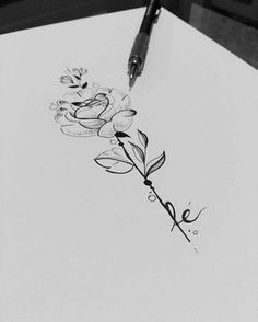 a drawing of flowers on paper with a pen