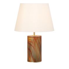 a table lamp with a white shade on it and a brown marbled cylinder in the middle