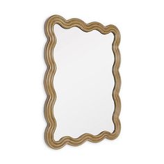 a wooden frame mirror on a white wall