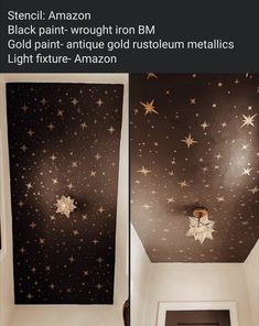 the ceiling is decorated with gold stars and white paint on black wallpaper, along with an open door