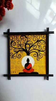 a painting on the wall with a buddha sitting under a tree in front of it