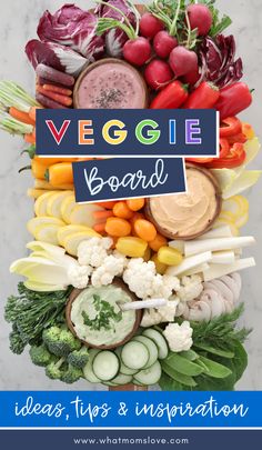 a vegetable board with the words veggie board on it and vegetables around it