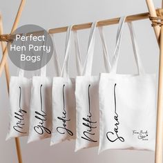 four bags with the words perfect hen party bags on them hanging from a clothes line