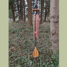 a wind chime in the middle of a forest