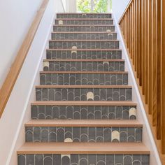 the stairs are decorated with art deco tiles