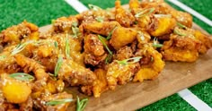 some food is sitting on a cutting board and ready to be eaten by someone else