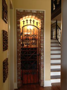 an entry way with a wrought iron gate