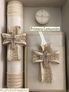 two wrapped presents are in a box with the words prima conunion written on them