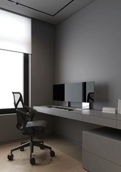 an office with a desk, chair and computer monitor