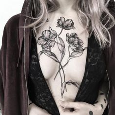 a woman's chest with flowers on it