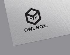 the owl box logo is shown in black and white