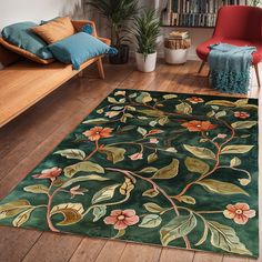 a green area rug with flowers and leaves on it in front of a wooden floor