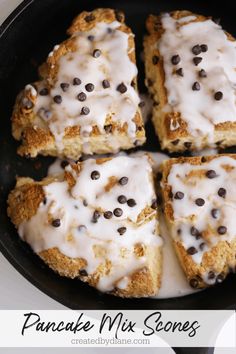 pancake mix scones in a cast iron skillet with icing and chocolate chips