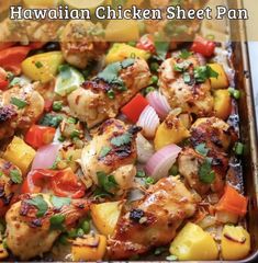 hawaiian chicken sheet pan with pineapples, onions, peppers, and cilantro