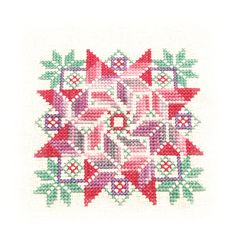 a cross stitch pattern with red, green and purple designs on it's side