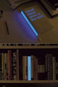 there are two books on the shelf and one is glowing blue in the dark,