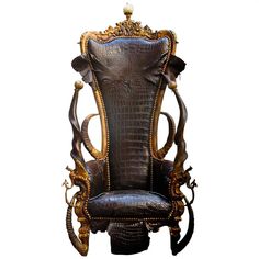 an ornate chair with leather upholstered on the back and arm rests in front of a white background