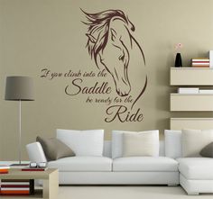 a living room wall with a horse decal on it