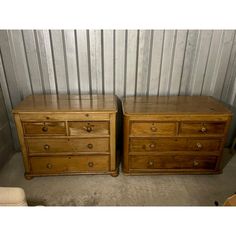 two wooden dressers sitting next to each other